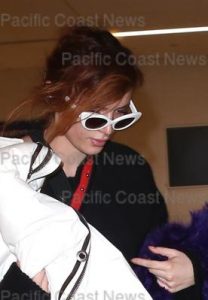 An extremely camera shy Bella Thorne arrives at LAX after attending The Sundance Film Festival in Utah. Los Angeles, California - Tuesday January 23, 2018.  Photograph: © MHD, PacificCoastNews. Los Angeles Office (PCN): +1 310.822.0419 UK Office (Avalon): +44 (0) 20 7421 6000 sales@pacificcoastnews.com FEE MUST BE AGREED PRIOR TO USAGE